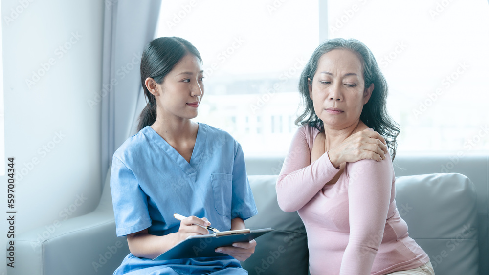 Asian Chinese female physiotherapist caregiver helping elderly woman exercise for recovery, prevention of osteoarthritis and osteoporosis. Asian Chinese female physiotherapist caregiver helping elderly woman exercise for recovery, prevention of osteoarthritis and osteoporosis.