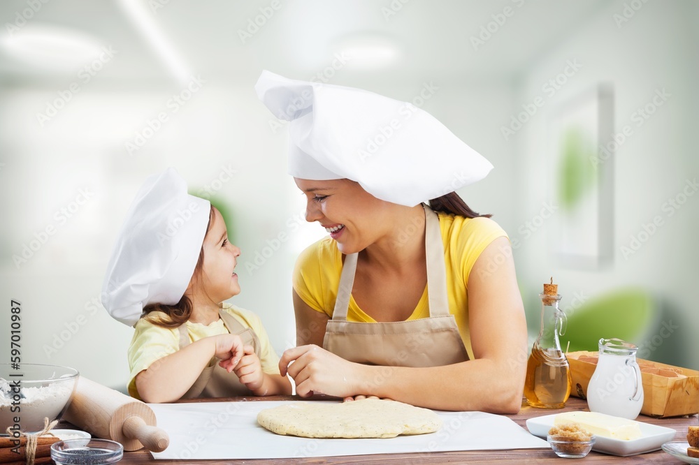 Happy Family, young mother and child baker Happy Family, young mother and child baker