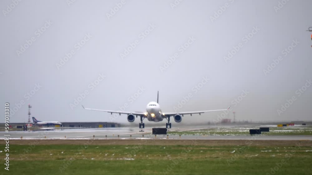 Airbus A330 Takeoff From the Runway, Cloudy Day, Low Angle Belly View. Airbus A330 Takeoff From the Runway, Cloudy Day, Low Angle Belly View.