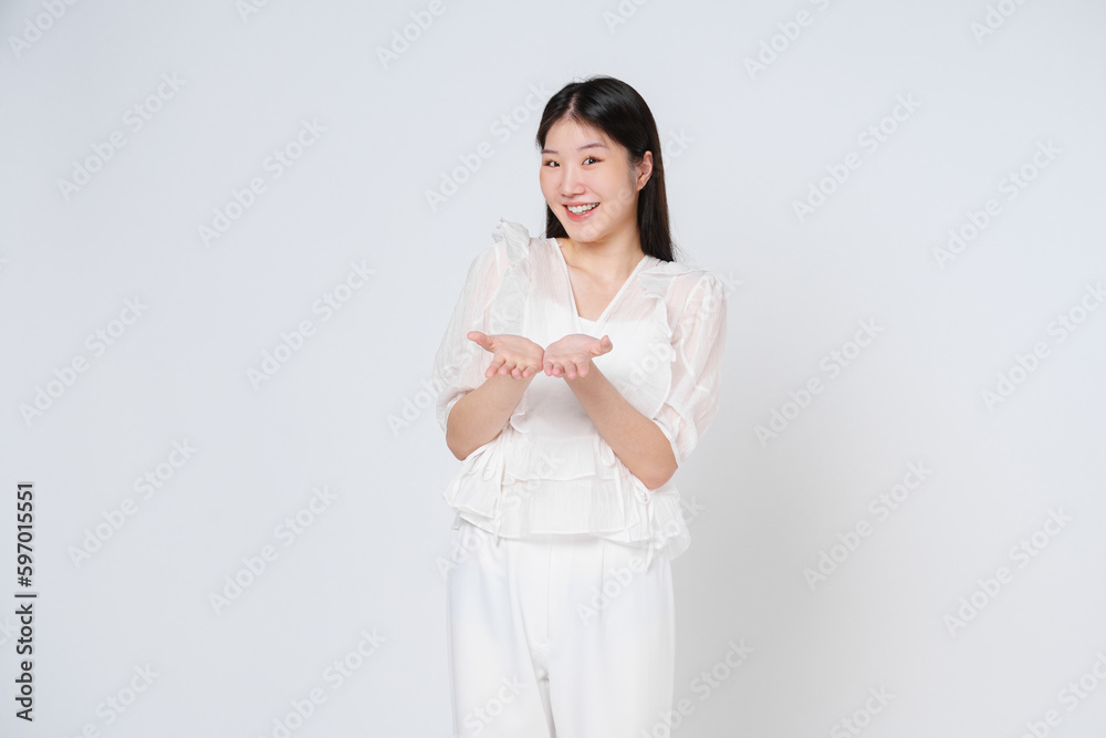 Happy woman presenting or showing open hand palm with copy space for product isolated over white background.