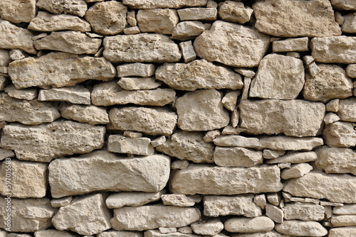 old wild stone wall without mortar 