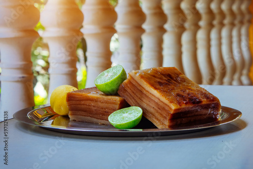 Bebinka is a traditional dessert from Goa, India. Layered cake of 10 layers according to the recipe of Portuguese monastery sweets and Goa cuisine. Sweet pudding based on coconut milk and flour photo