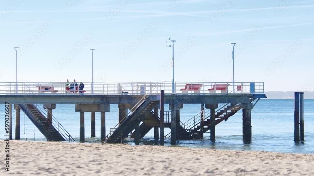 Scenic View Of A Pier On The Seashore Of Arcachon Beach During Daytime In France. static Scenic View Of A Pier On The Seashore Of Arcachon Beach During Daytime In France. static