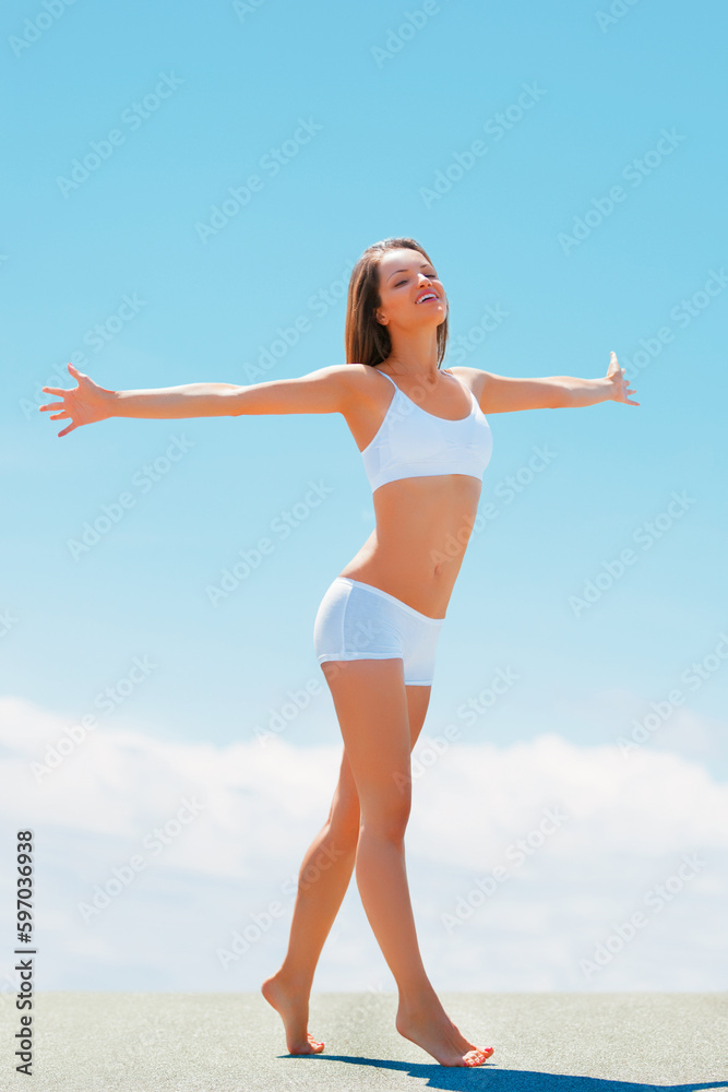 Blue sky, stretching arms and happy woman in underwear with fitness, freedom and achievement of health goals. Mockup, happiness and sports model with sunshine space, healthy mindset and celebration. Blue sky, stretching arms and happy woman in underwear with fitness, freedom and achievement of health goals. Mockup, happiness and sports model with sunshine space, healthy mindset and celebration.