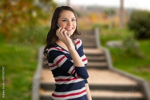 Beautiful young woman using smartphone