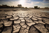 Cracked land in a dry lake caused by climate change. Generative AI.