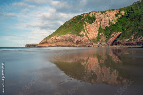 Ballota beach in llanes with its famous rock formation at sunset  Asturias  Spain