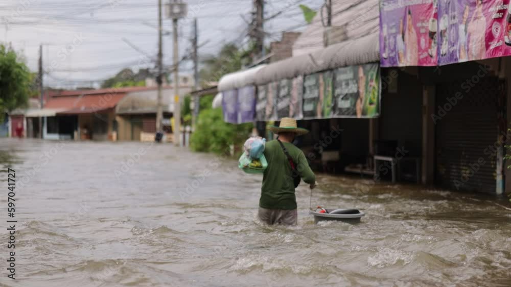 High-angle view of the Great Flood, Meng District, Thailand, on October 3, 2023, is a photograph from real flooding. With a slight color adjustment
