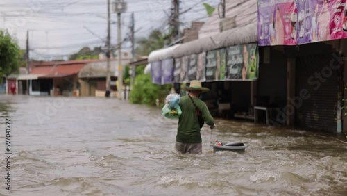 High-angle view of the Great Flood, Meng District, Thailand, on October 3, 2023, is a photograph from real flooding. With a slight color adjustment