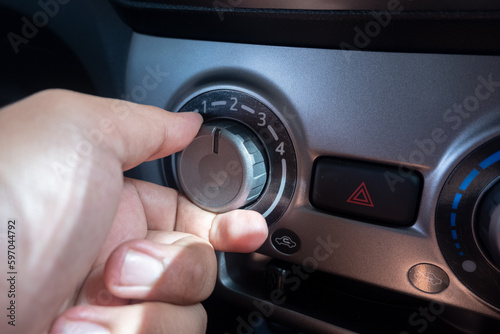 selectively focus on the air conditioner (AC) control panel on the car dashboard. soft focus. under exposure