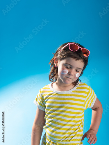 girl with doubtful expression on blue background © 23_stockphotography