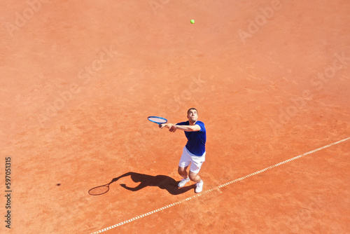Tennis Player Serving on a Clay Court
