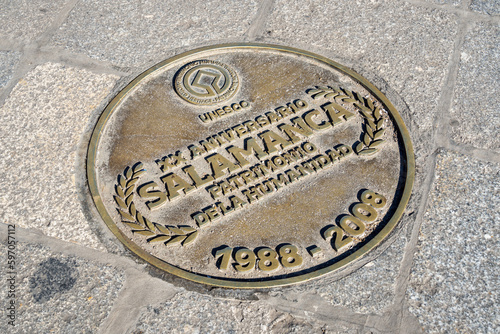 Salamanca, Spain - February 9, 2023: UNESCO plate on the ground at Plaza Mayor Salamanca Spain.