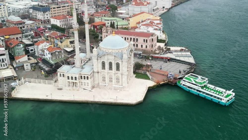 Grand Mecidiye Ortakoy Mosque with martyrs bridge in the back zoom-in circle photo