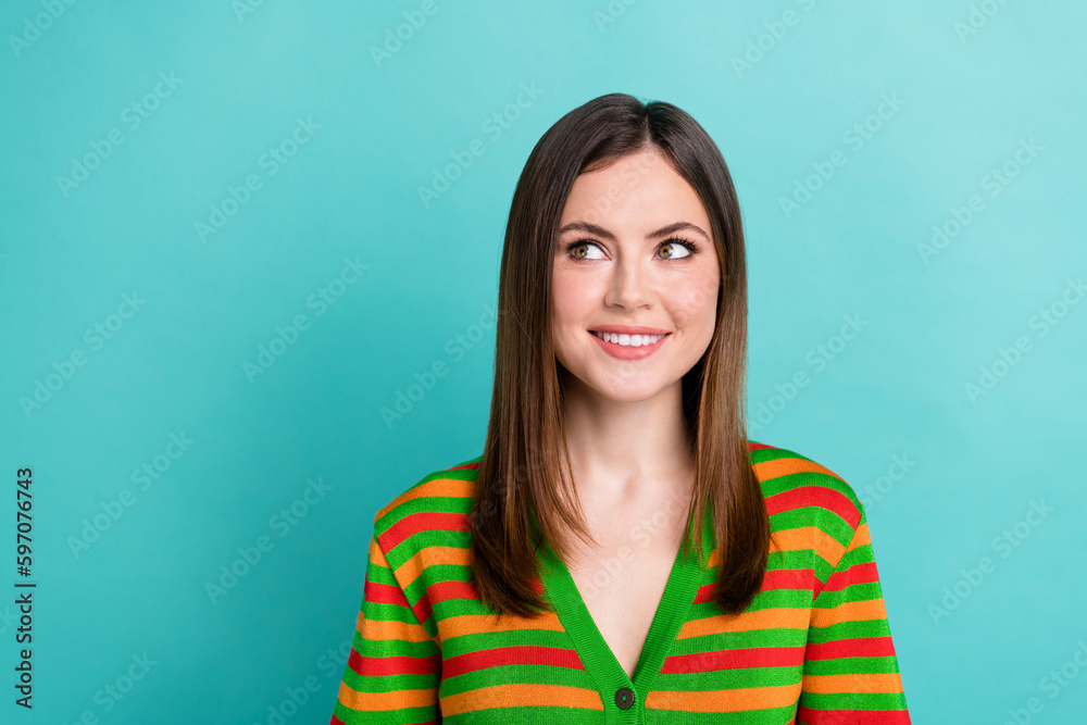 Photo of cute dreamy lady wear striped cardigan looking empty space isolated turquoise color background