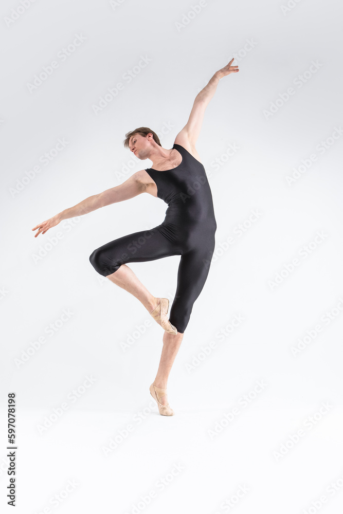 Modern Ballet Dancing. Contemporary Art Ballet of Young Caucasian Athletic Man in Black Suit Dancing