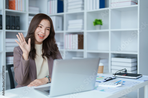 Beautiful young teen asian business woman meeting at on computer laptop with planning working on financial document, tax, exchange, accounting and Financial advisor