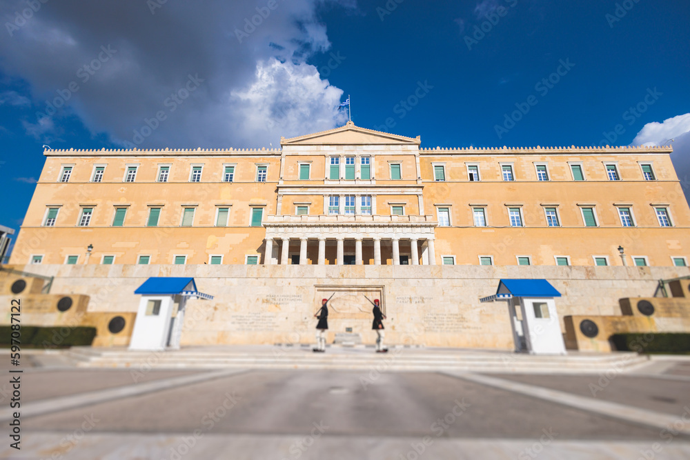 Greek Parliament in Old Royal Palace building facade exterior, Hellenic Bouleterion parliament house on Syntagma square, Athens, Attica, Greece in a summer day