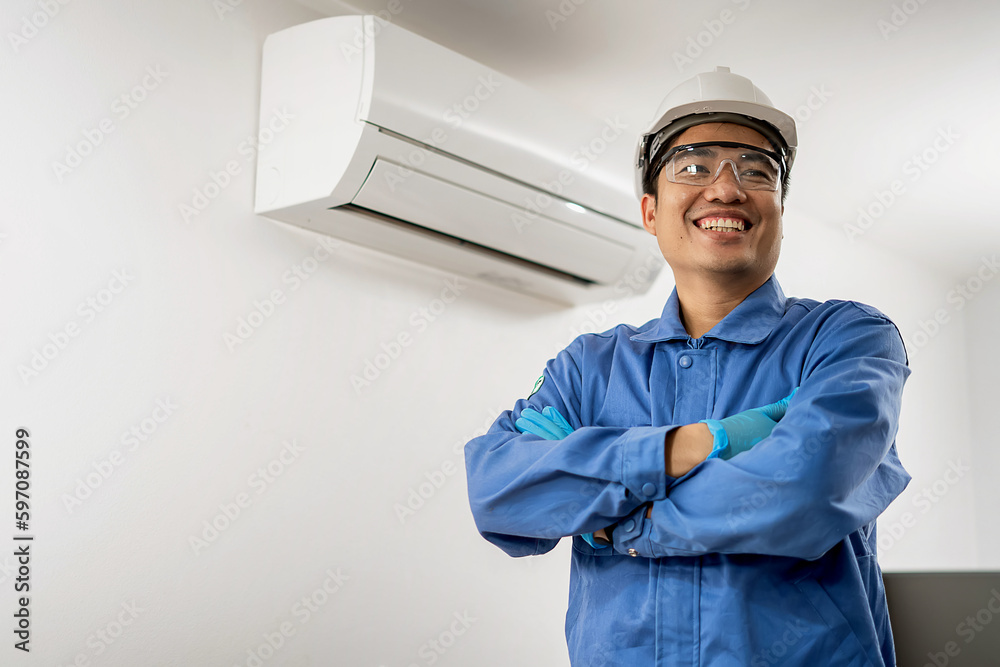 Air conditioner maintenance man showing joy, indoor air conditioning background Air conditioning maintenance technician concept Air conditioner maintenance man showing joy, indoor air conditioning background Air conditioning maintenance technician concept