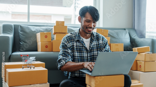 Mixed race Asian indian ethnicity young man chinese transport shipment delivery service sme parcel cardboard box package on delivery small business owner SME, shopping online