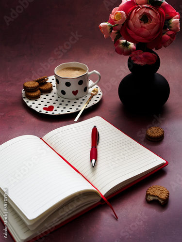 Notebook pencil coffee and biscuits