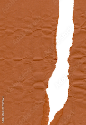 Vertical tear on thin cardboard wrapping paper with dented texture
