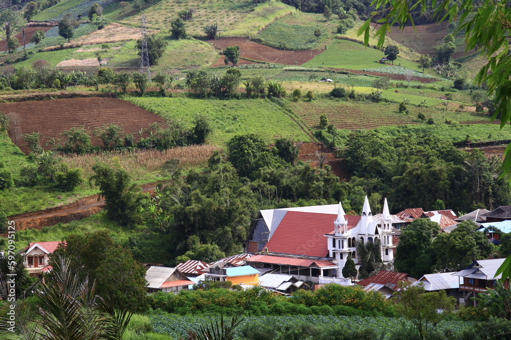 Village atmosphere on the hills, there is a church in the middle of the settlement