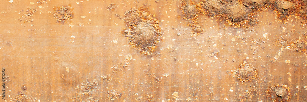 Rust of metals.Corrosive Rust on old iron with a hole. Rusted orange painted metal wall. Rust of metals.Corrosive Rust on old iron with a hole. Rusted orange painted metal wall.