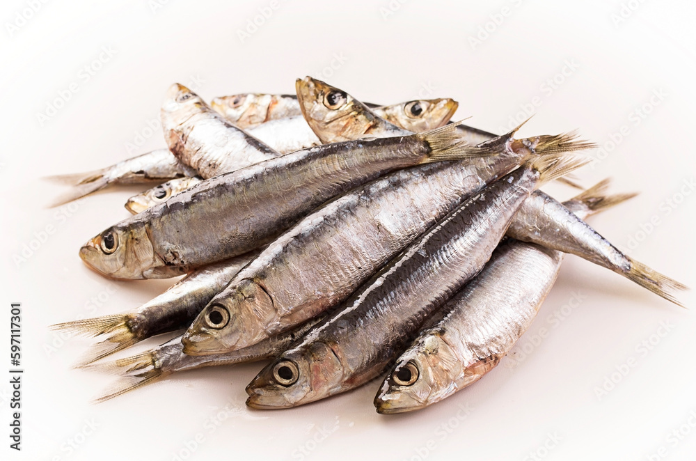 Traditional Portuguese raw anchovies offered as close-up on white background Traditional Portuguese raw anchovies offered as close-up on white background
