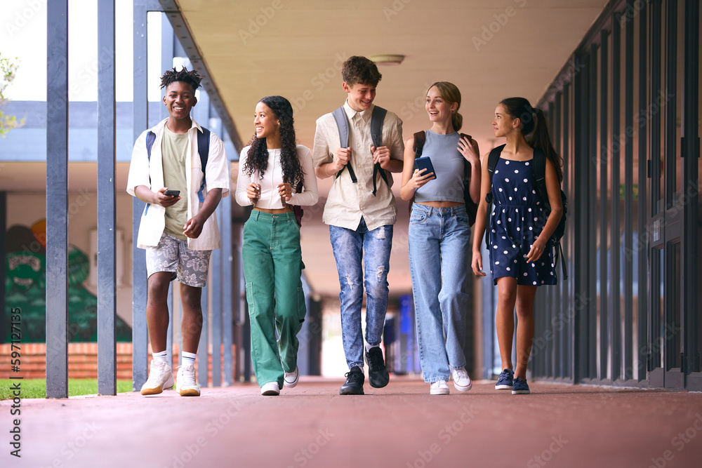 Fototapeta premium Group Of Multi-Cultural High School Or Secondary School Pupils Outdoors Walking To Class