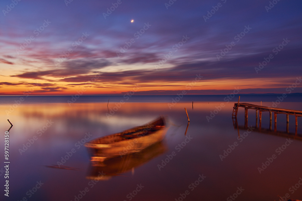 sunrise with boats on the lake in the Danube Delta 2