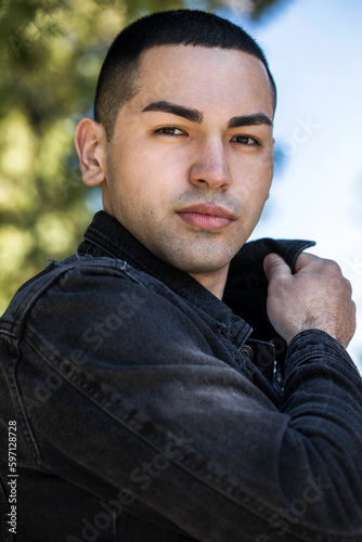 Close up portrait of a young beautiful brunette guy