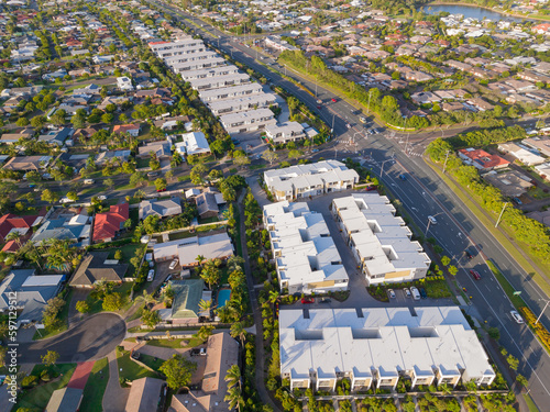 Aerial view of residential developments alongside a major road