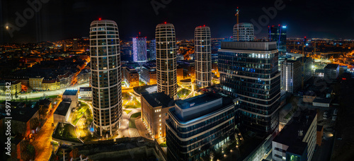 Photography Bratislava city downtown skyline at night, illuminated modern high-rising buildi