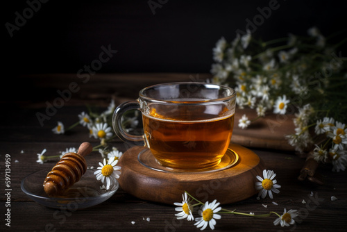 cozy cup of chamomile tea with honey on a rustic wooden table