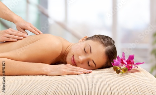 Happy young woman on relaxing massage