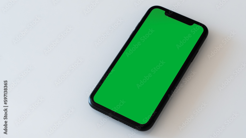 A Green Screen Smartphone on a White Table A Green Screen Smartphone on a White Table
