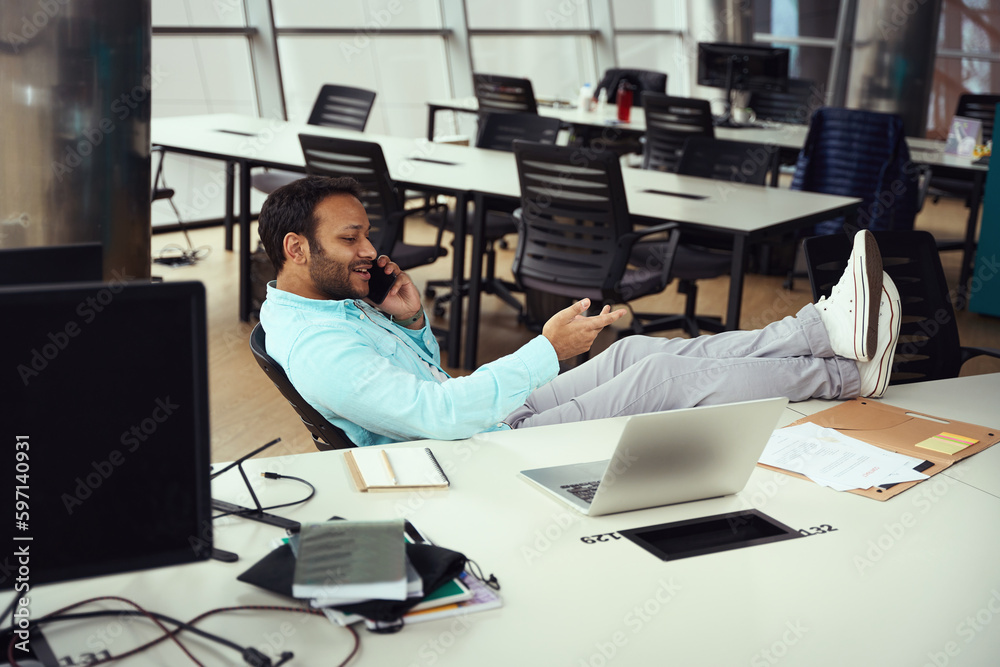 Man talking on the phone in the business center Man talking on the phone in the business center