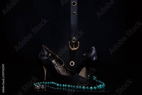 Still life - female shoe, sunglasses, beads and others female accessories