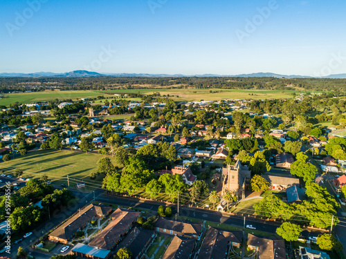 Housing units church and sport field seen from aerial view in Singleton