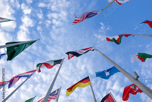 Doha, Qatar - April 25, 2023: Flags of countries in the old port of Doha, Qatar