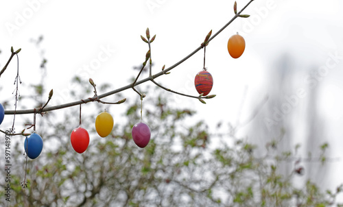 Easter bouquet with colored eggs on a branch
