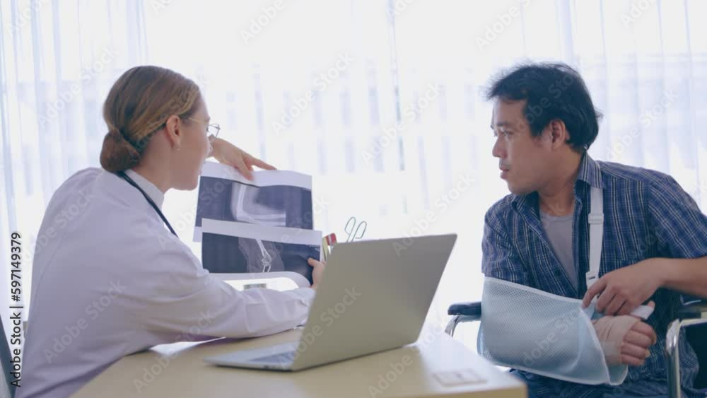 Caucasian Woman doctor talking consultant describe treatment of broken arm bone to patient man in hospital. service with modern medical technology. explain care. Concept medical care orthopedic Caucasian Woman doctor talking consultant describe treatment of broken arm bone to patient man in hospital. service with modern medical technology. explain care. Concept medical care orthopedic