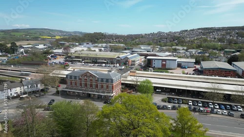 Circling Newton Abbot train station showing wider town, Devon UK