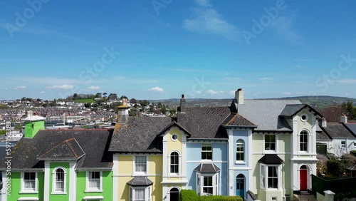 Ascending over row of houses to reveal Newton Abbot