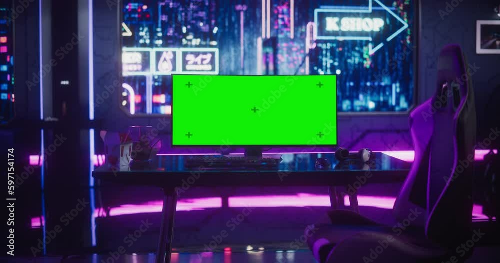 Empty Gaming Station with Green Screen Mock Up Computer Display. Online eSports Gaming Tournament Live Stream. Monitor on a Table in a Futuristic Cyberpunk Room with Neon Light Empty Gaming Station with Green Screen Mock Up Computer Display. Online eSports Gaming Tournament Live Stream. Monitor on a Table in a Futuristic Cyberpunk Room with Neon Light