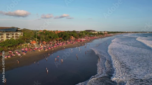 Bali, Indonesia: Aerial drone footage of the Seminyak beach in Kuta, famous for its waves, beach bars, surf and sunset, in southern Bali in Indonesia. Shat as an hyper lapse photo