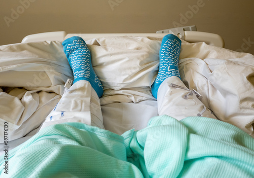Murais de parede A hospital patient wearing inflatable compression leg presses to prevent blood clots during surgery