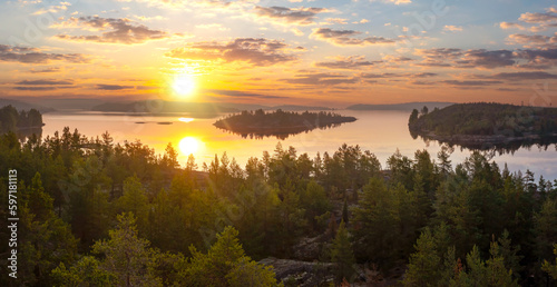 Karelia sunset. Russia landscape. Ladoga lake. Forest on river bank. Karelian isthmus. Sunset over Ladoga. Islands of Karelia. Nature of Russia. Karelia view from quadrocopter. Russian federation photo