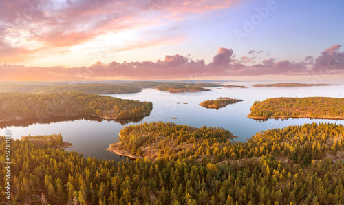 Karelian isthmus. Lakes of Russia. Ladoga aerial view. Forests of Karelia. Ladoga lake. Coniferous nature. Landscape of Russian taiga. Republic Karelia. Sunset over forest. Karelia in summer evening © Grispb